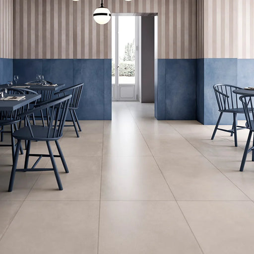 Dettaglio piastrella in gres porcellanato effetto cemento nuvolato della collezione R-Evolution di Casalgrande, formato 60x120 cm, colore Sand