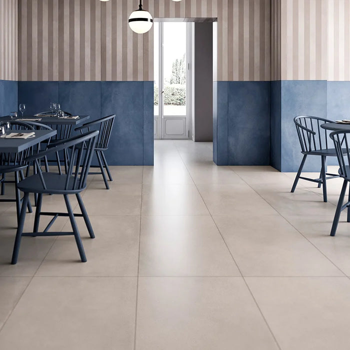 Dettaglio piastrella in gres porcellanato effetto cemento nuvolato della collezione R-Evolution di Casalgrande, formato 60x120 cm, colore Sand